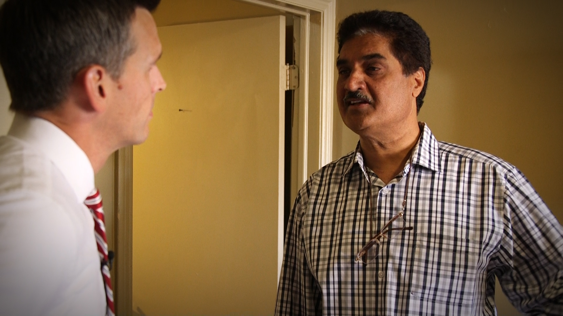 Jaswinder Singh, the owner of the Gateway Inn, talks with Mike Headrick.