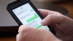 Jay Schmidt shows the texts between himself and a scammer.