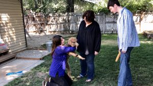 Kimberly Garrard, center, lost her husband, Ben. Her kids are dangerously heat intolerant. WW MinIstering Angels paid for and installed a new A/C for them. (KSL-TV)