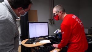 Steve Blair uses a spectrometer to measure the wavelength of each device to see if they actually fall within a germicidal wavelength range. (KSL-TV)