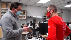 KSL Investigator Matt Gephardt and University of Utah electrical engineer Steve Blair review the directions for a UV light wand bought online. (KSL-TV)