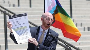 Derek Kitchen holds a copy of Utah code regarding marriage recognition policy during a press conference about same-sex marriage on Tuesday, June 7, 2022. (Jeffrey D. Allred, Deseret News, File)
