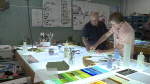 Ali Albaddah and Tom Holdman working together. (KSL TV)