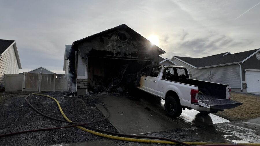Eagle Mountain family safely escapes house fire, crews prevent home