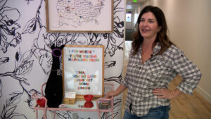 Kim Cannon stands next to a board showing what she called the best quote in the movie. (KSL TV)