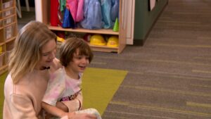 Natalia playing with one of the kids at ASSERT. (KSL TV)