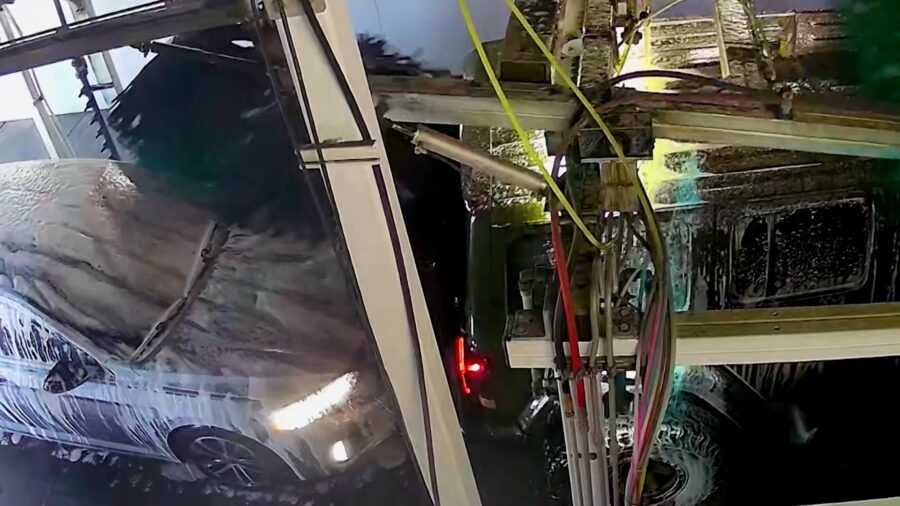 A camera inside the Quick Quack Car Wash tunnel shows Lynzee Delapaz’s Volkswagen being pulled into the back of the Jeep ahead of her. (Lynzee Delapaz)