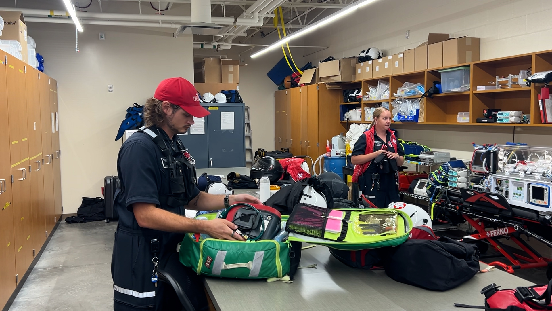 The Life Flight crews packing up their equipment before heading to the chopper. (KSL TV)
