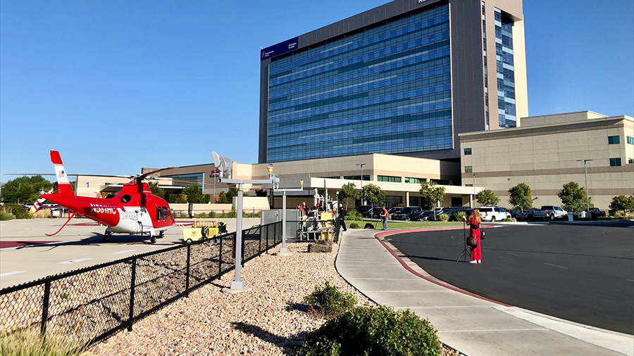 The Utah Valley Hospital Life Light team outside of the helicopter and the hospital. (KSL TV)