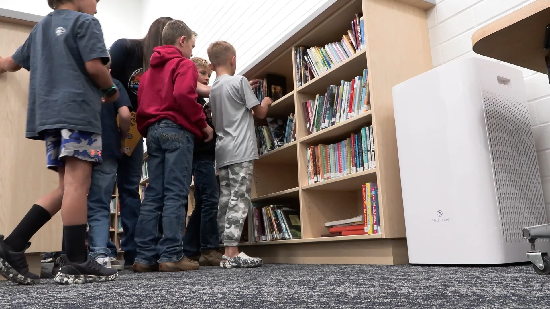 The class enjoying the new library. (KSL TV)