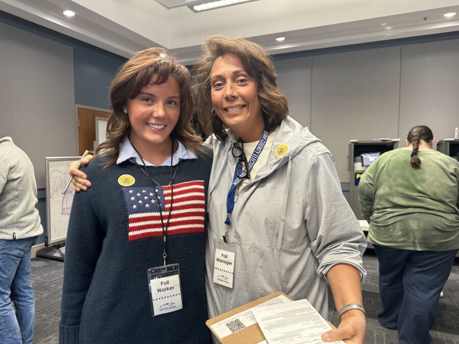 Avery Cornaby-Luke (left) and her mother Nicole Cornaby (right) working at the early in-person voting location in Provo on Nov. 4, 2024. (Dan Rascon, KSL TV)
