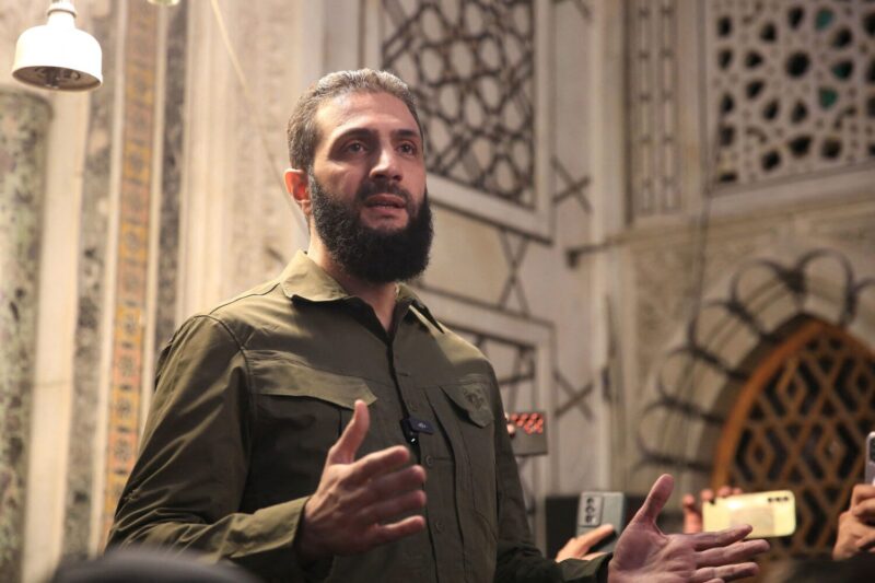 The leader of Syria's Islamist Hayat Tahrir al-Sham (HTS) group Abu Mohammed al-Jolani at the capital's landmark Umayyad Mosque on December 8. (Aref Tammawi/AFP/Getty Images)