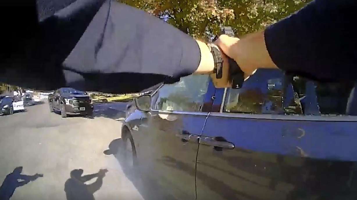 Sandy police officers pointing weapons at Malachi on Nov. 9, 2023, moments after an officer fired multiple shots, killing Malachi. (The Sandy Police Department)