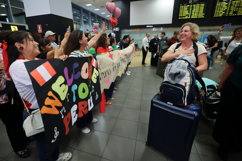 Abby Beattie is greeted as she and other members of The Tabernacle Choir and Orchestra at Temple Square at the Jorge Chavez International Airport in Lima, Peru, as the choir and orchestra arrive for the “Songs of Hope” world tour on Tuesday, Feb. 18, 2025. (Kristin Murphy, Deseret News)