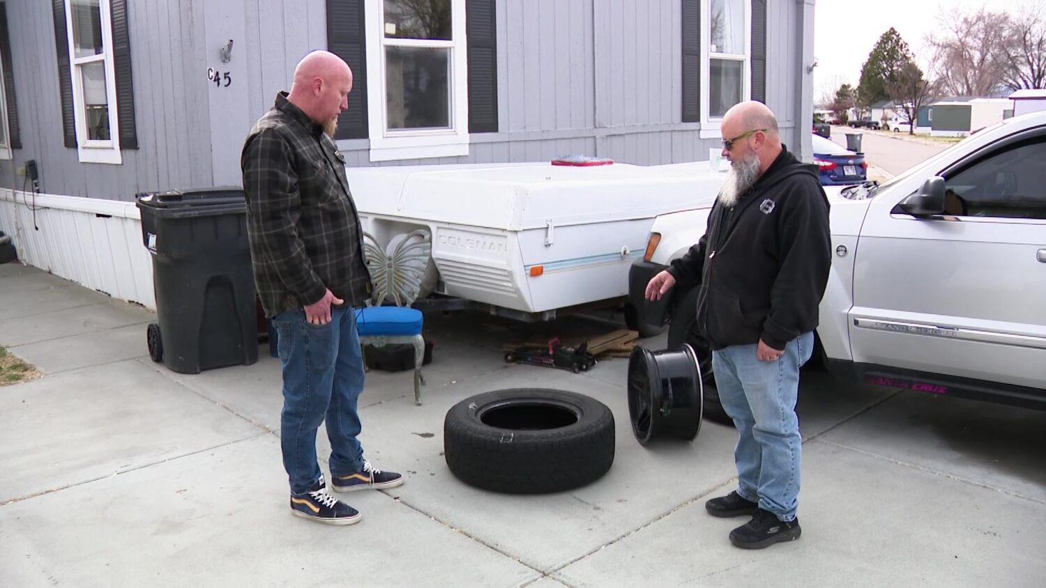 Kevin Wade gifting Jerriad Wallace a new set of tires. (KSL TV)