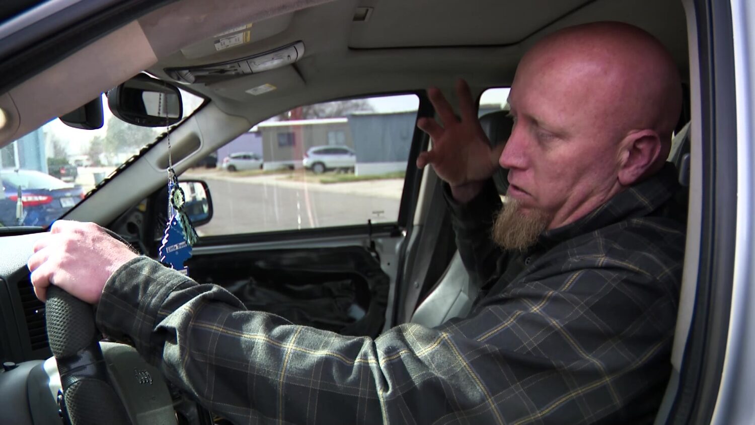 Jerriad Wallace describing the feeling of glass hitting his face after bullets hit his passenger car door. (KSL TV)