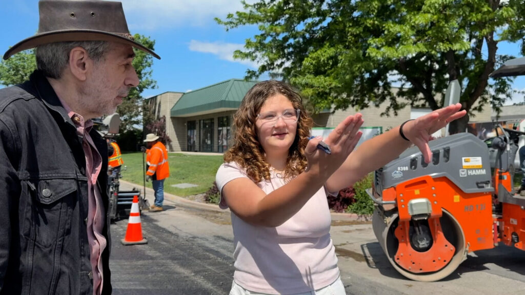 Orem High student Julianna Snow talks with Director Alan Weiss on the set of their PSA about driving safety. (KSL TV)