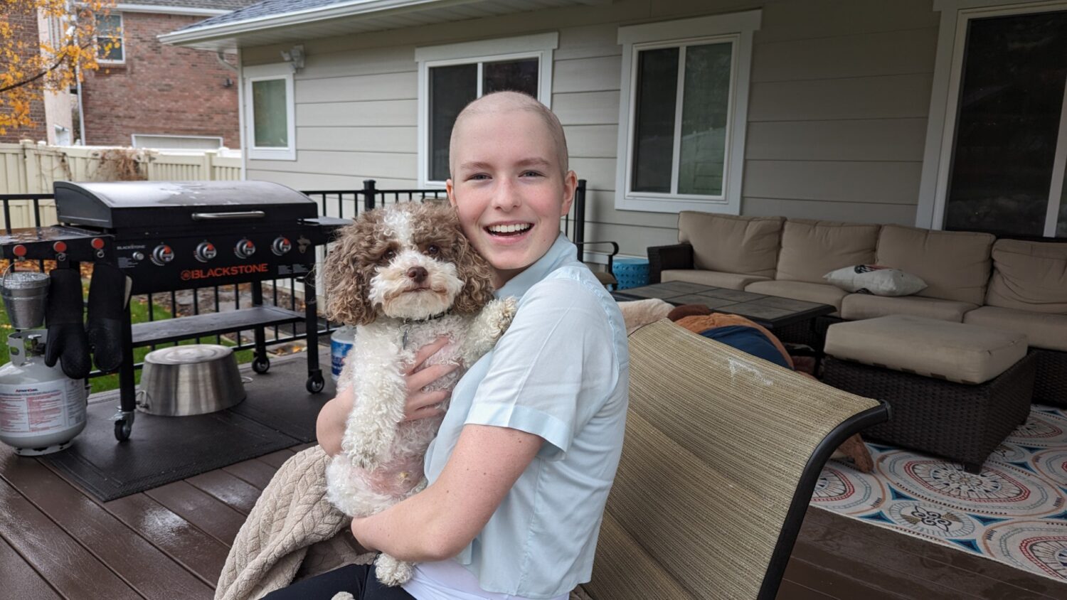 Olivia Smart holding her family dog while she was fighting Leukemia. (Smart Family)