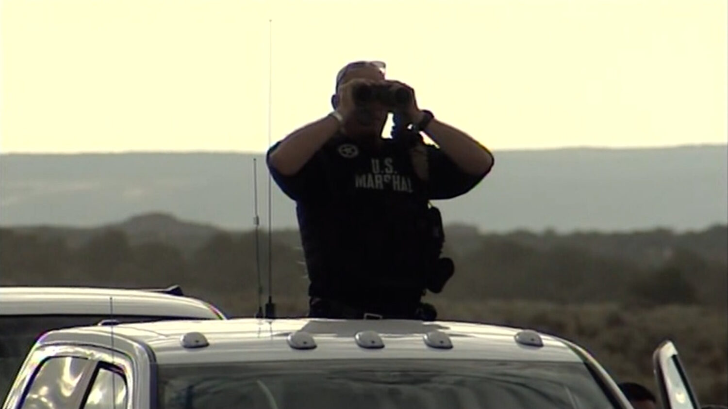 One of the many police officers and sheriff deputies searching for Scott Curley in 2010. (KSL TV)