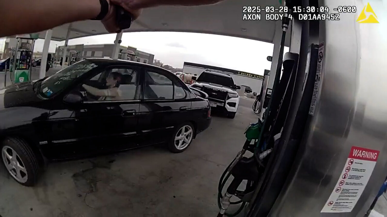 Haley Sullivan driving away after hitting a Lehi police officer's car with her car. (The Lehi Police Department)