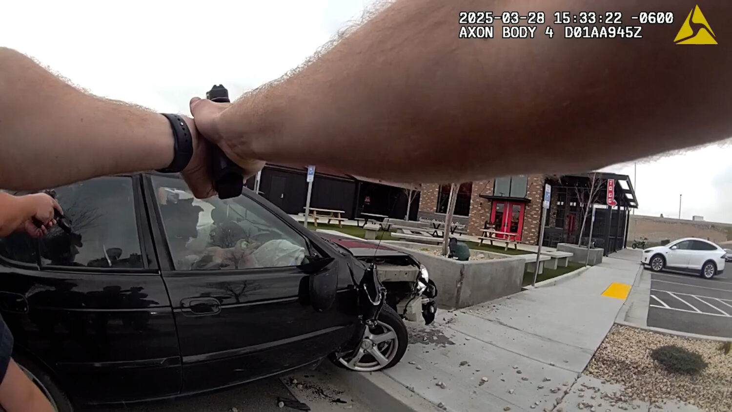 Officers surrounding Haley Sullivan while a K9 is inside the car. (The Lehi Police Department)