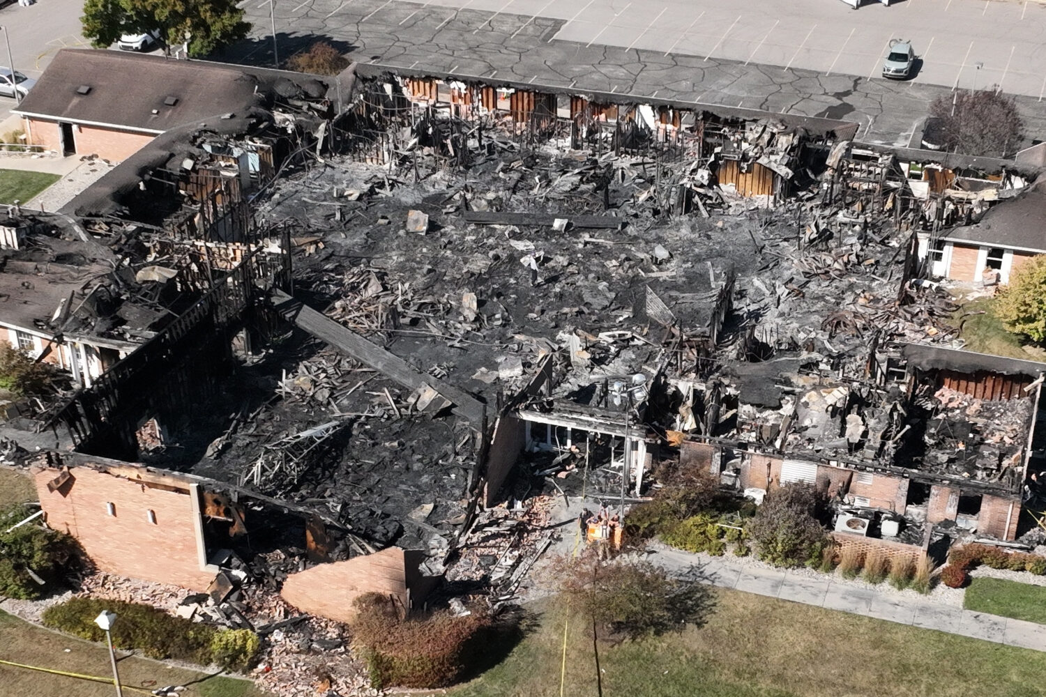 Little remained of The Church of Jesus Christ of Latter-day Saints meetinghouse the day after a gunman opened fire and set the building ablaze in Grand Blanc Township, Mich., Monday, Sept. 29, 2025. (AP Photo/Mark Vancleave)