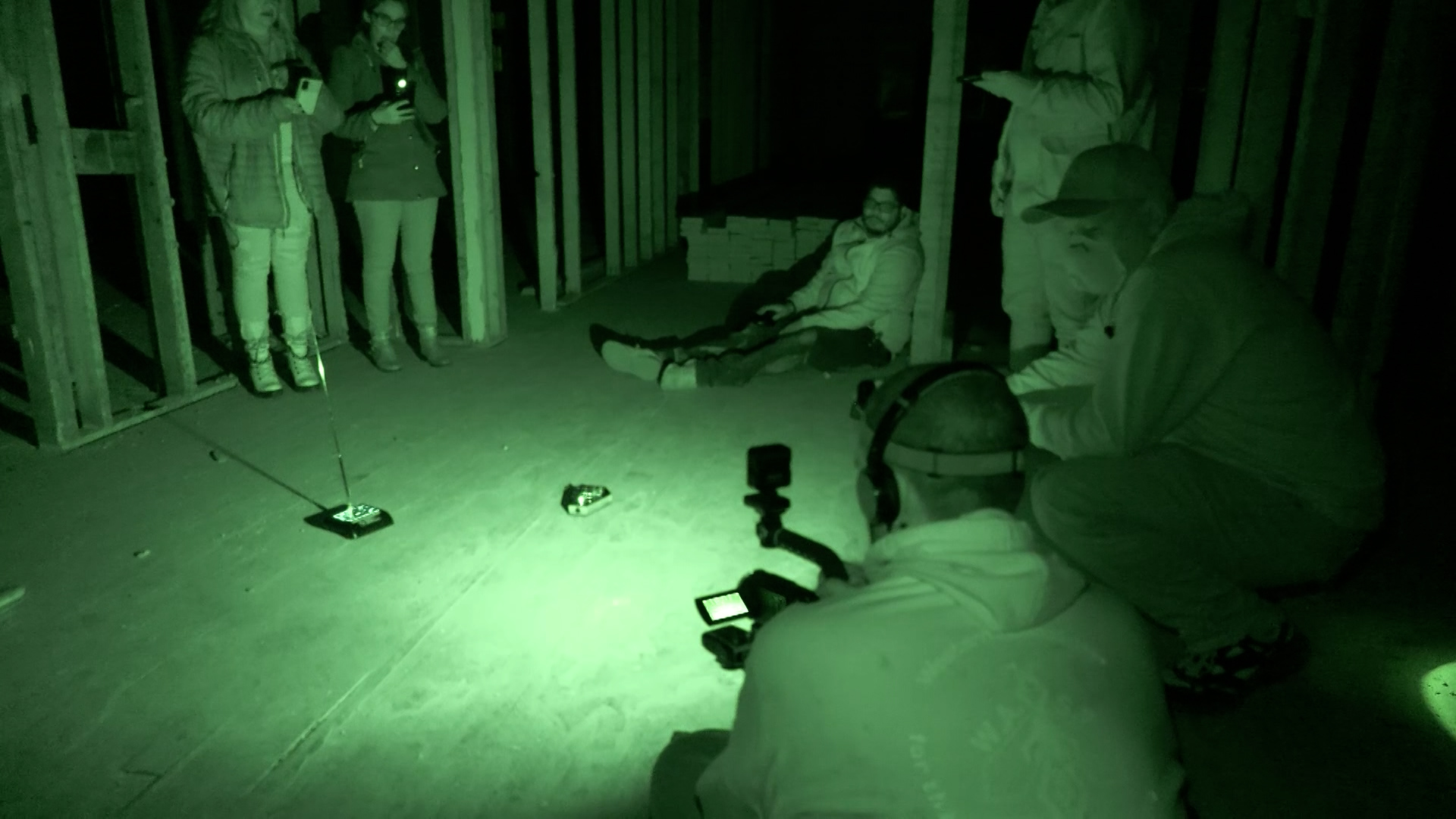 The paranormal team speaking to a spirit who was communicating to them through a motion-sensitive music box in 2022. (Jay Hancock, KSL TV)