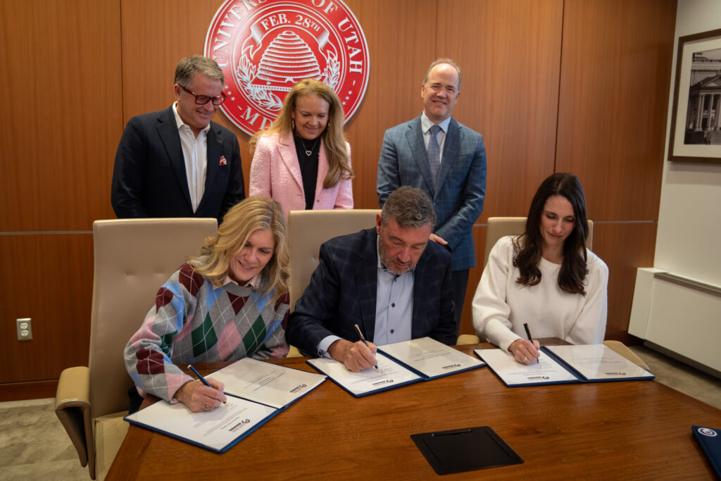 BACK ROW, Left to Right: Taylor Randall, President, University of Utah; Christena Huntsman Durham, CEO, Huntsman Mental Health Foundation; Bob S. Carter, MD, PhD, CEO of University of Utah Health FRONT ROW: Siblings Melissa Layton, Gregg Savage, and Emilee Savage Wright sign letters of intent for their $10 million gift. (Huntsman Mental Health Foundation)