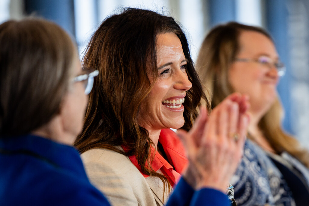 Brandi Webster, principal of Mona Elementary, center, smiles as Sen. Ann Millner, R-Ogden, left, claps for her during a Literacy and Reading Symposium hosted by Gov. Spencer Cox and first lady Abby Cox at The Monarch in Ogden on Tuesday, Jan. 6, 2026. (Tess Crowley, Deseret News)