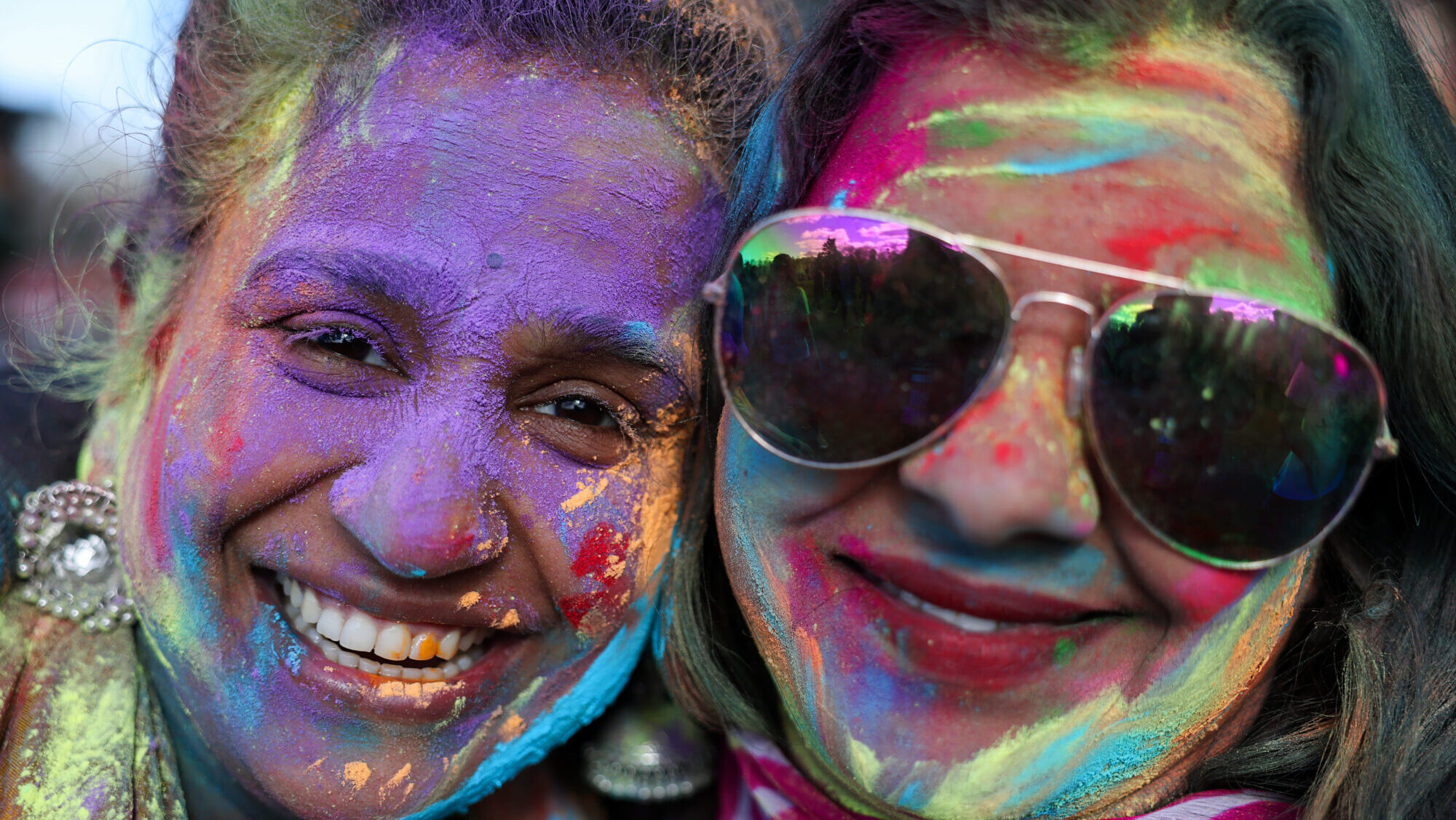 FILE: Members of the public take part in Holi festival celebrations at Rouken Glen Park on March 15, 2025 in Glasgow, Scotland. (Jeff J Mitchell, Getty Images)