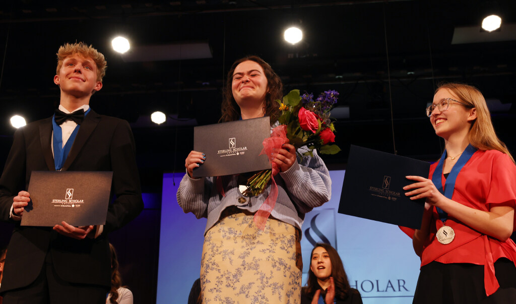 Sarah Pace of Bear River High attempts to hold back the emotions as she is honored as the Sterling Scholar in science alongside runners-up Rockland Stout of Stansbury, left, and Senya Walker of Hillcrest during the Sterling Scholar Awards presentation at the Bountiful Regional Center in Bountiful, Thursday, April 16, 2026. (Brian Nicholson, for the Deseret News)