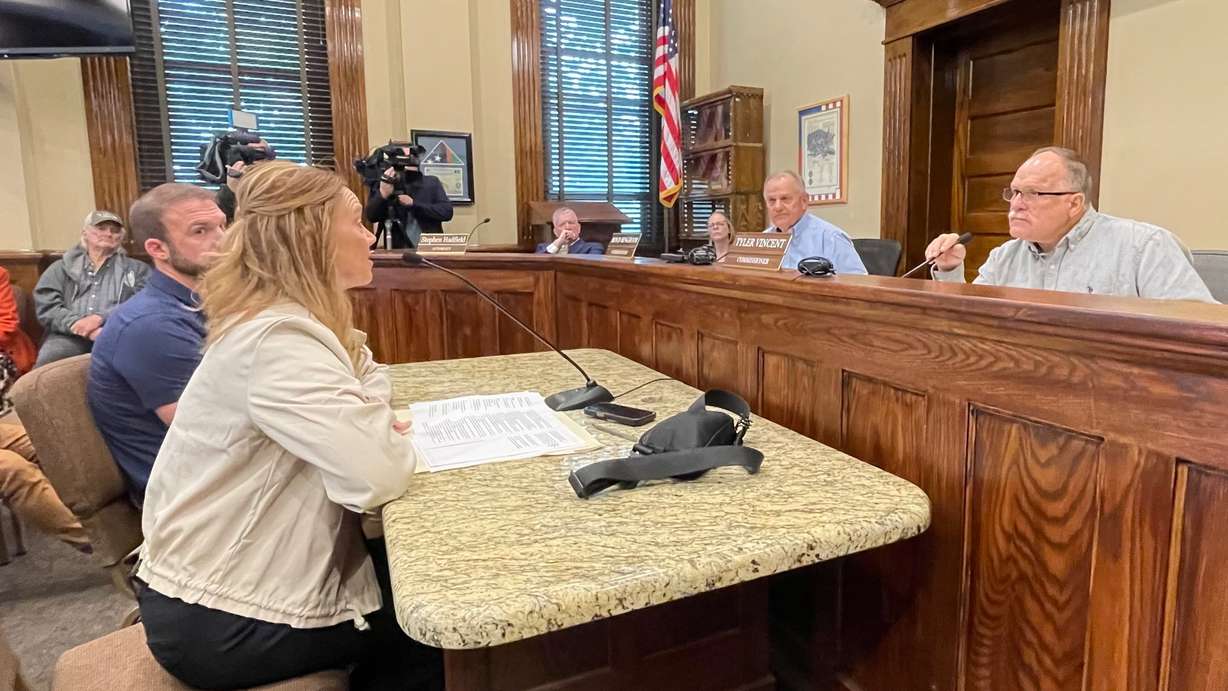 Box Elder County commissioners on Monday tabled action on a data center proposal that recently came to public light. The photo shows County Commission Chairman Tyler Vincent, right, listening to Hilary Venable of MIDA. The meeting was held at the Box Elder County Courthouse in Brigham City. (Photo: Tim Vandenack, KSL.com)