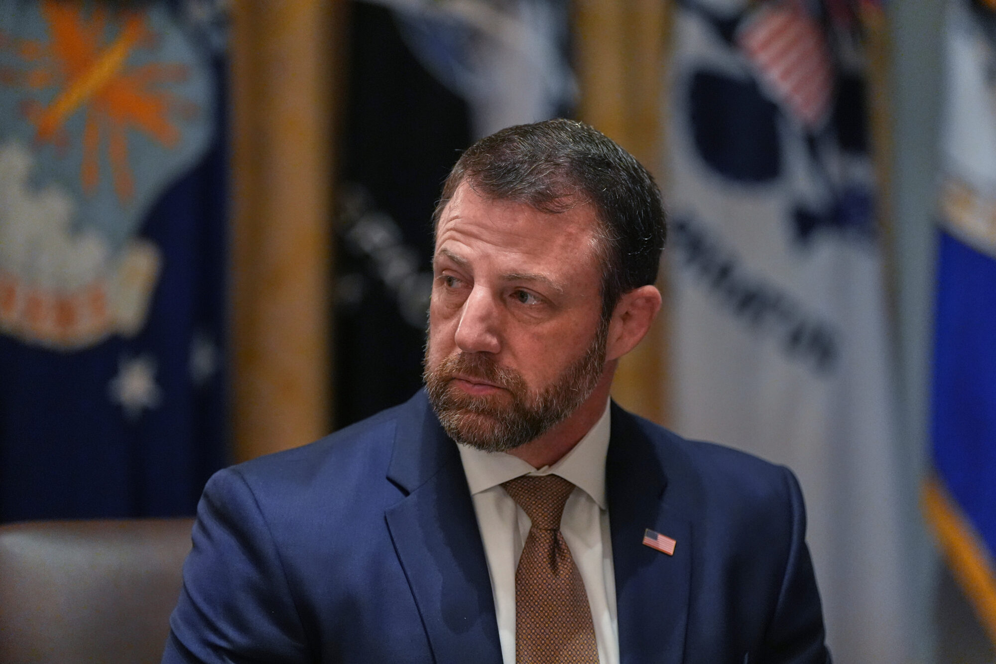 Homeland Security Secretary Markwayne Mullin listens during a Cabinet meeting at the White House, Thursday, March 26, 2026, in Washington. (AP Photo/Alex Brandon)