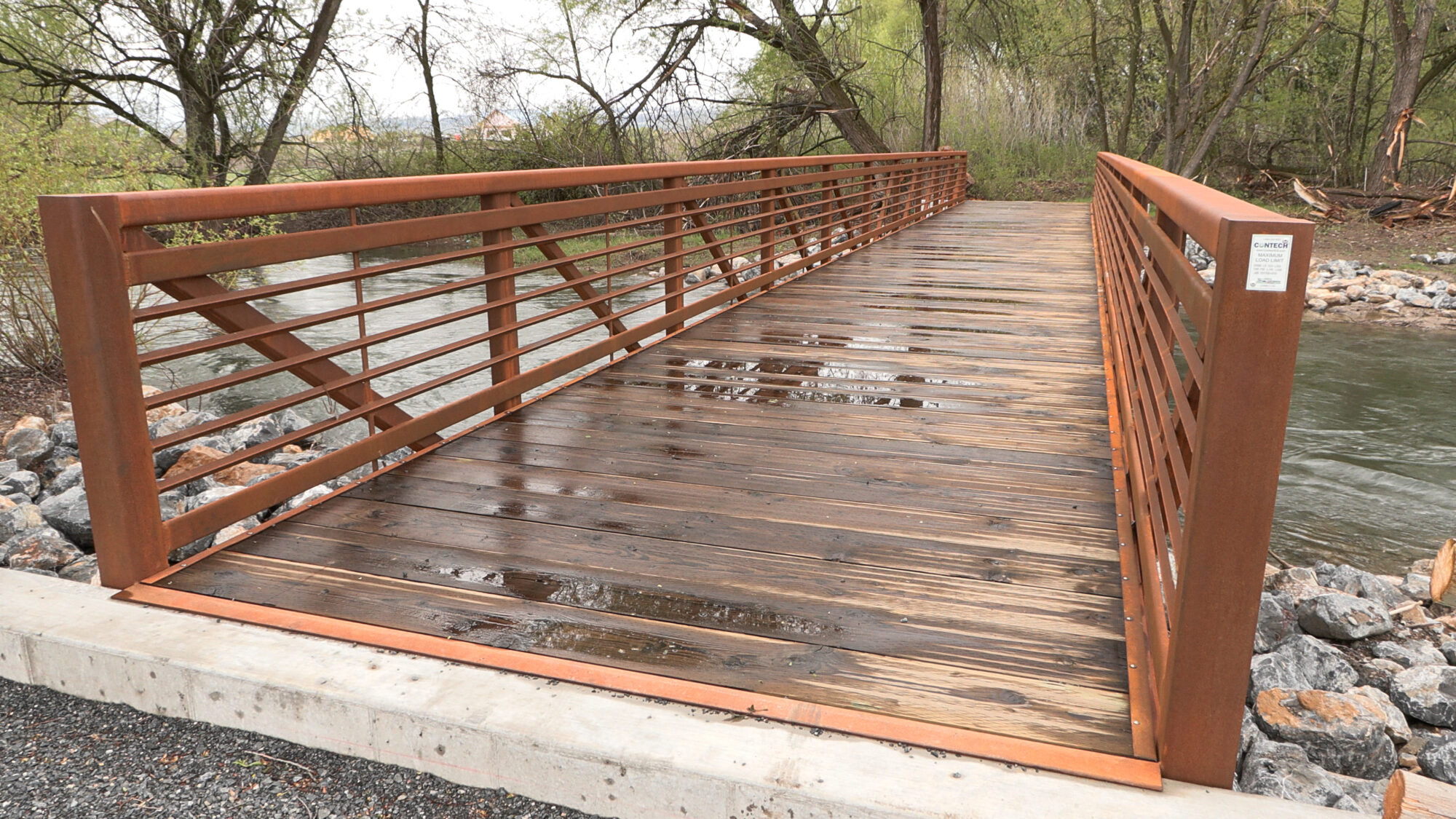 A large pedestrian bridge extends walking trails through Trapper Park, as part of a restoration project along the Logan River. (Mike Anderson, KSL)