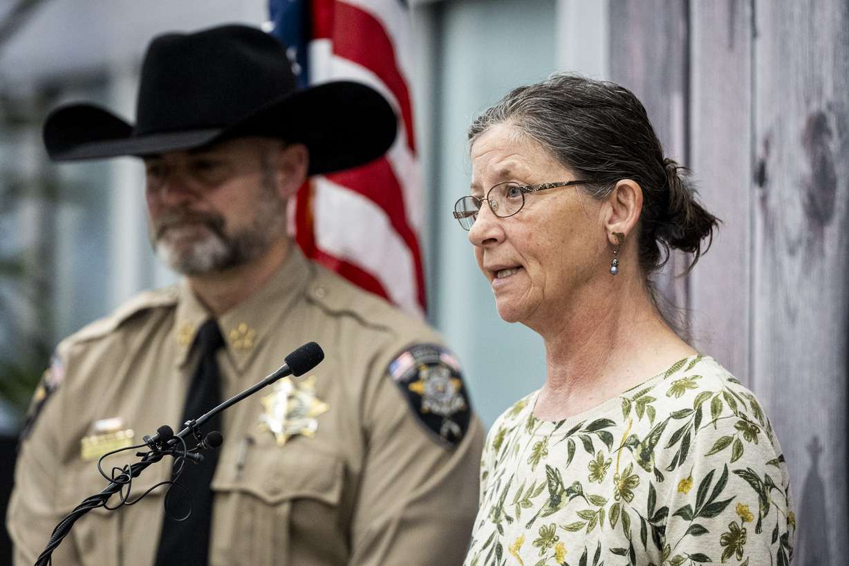 Michelle Impala, younger sister of Laura Aime, speaks while joined by Utah County Sheriff Mike Smith during a press conference announcing definitive evidence has been found that Ted Bundy murdered Laura Ann Aime in 1974, held at the Utah County Sheriff's Office in Spanish Fork on Wednesday. (Photo: Isaac Hale, Deseret News)
