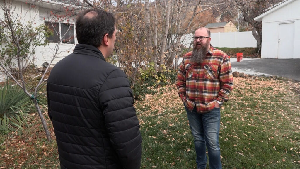 Homeowner Cory Bluemel tells KSL's Matt Gephardt that the paver he hired to install an asphalt pad in his yard didn't use the right material, costing him thousands of dollars. (Meghan Thackrey, KSL)