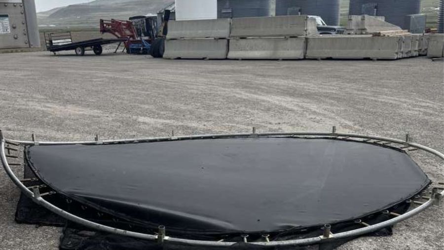 Wind damage shows a trampoline that blew into a neighbors semi trailer in Riverside on Wednesday. (Photo: John Godfrey)
