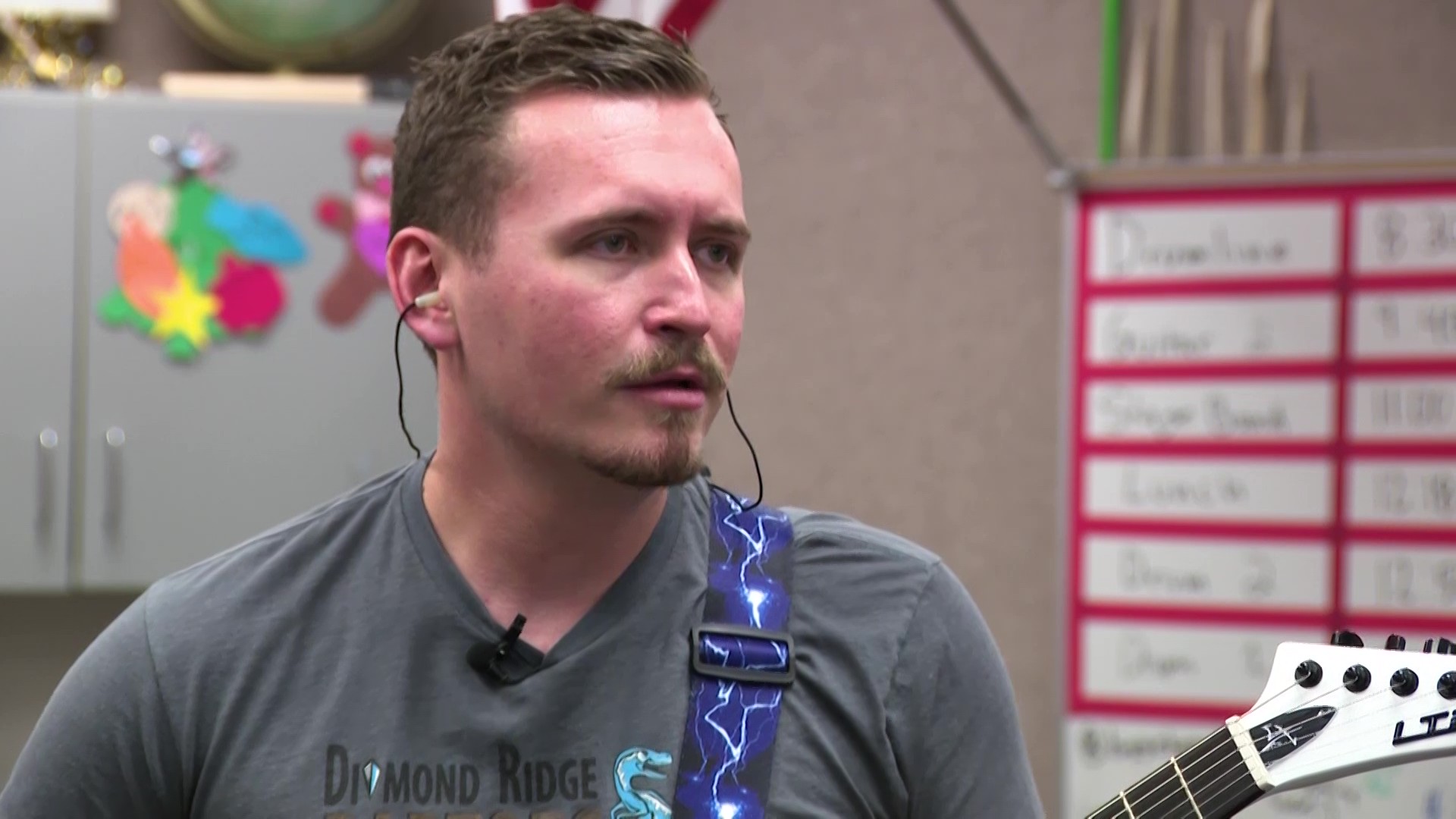 Brandon Lupus plays guitar with his students at Diamond Ridge High School. (Ray Boone, KSL)