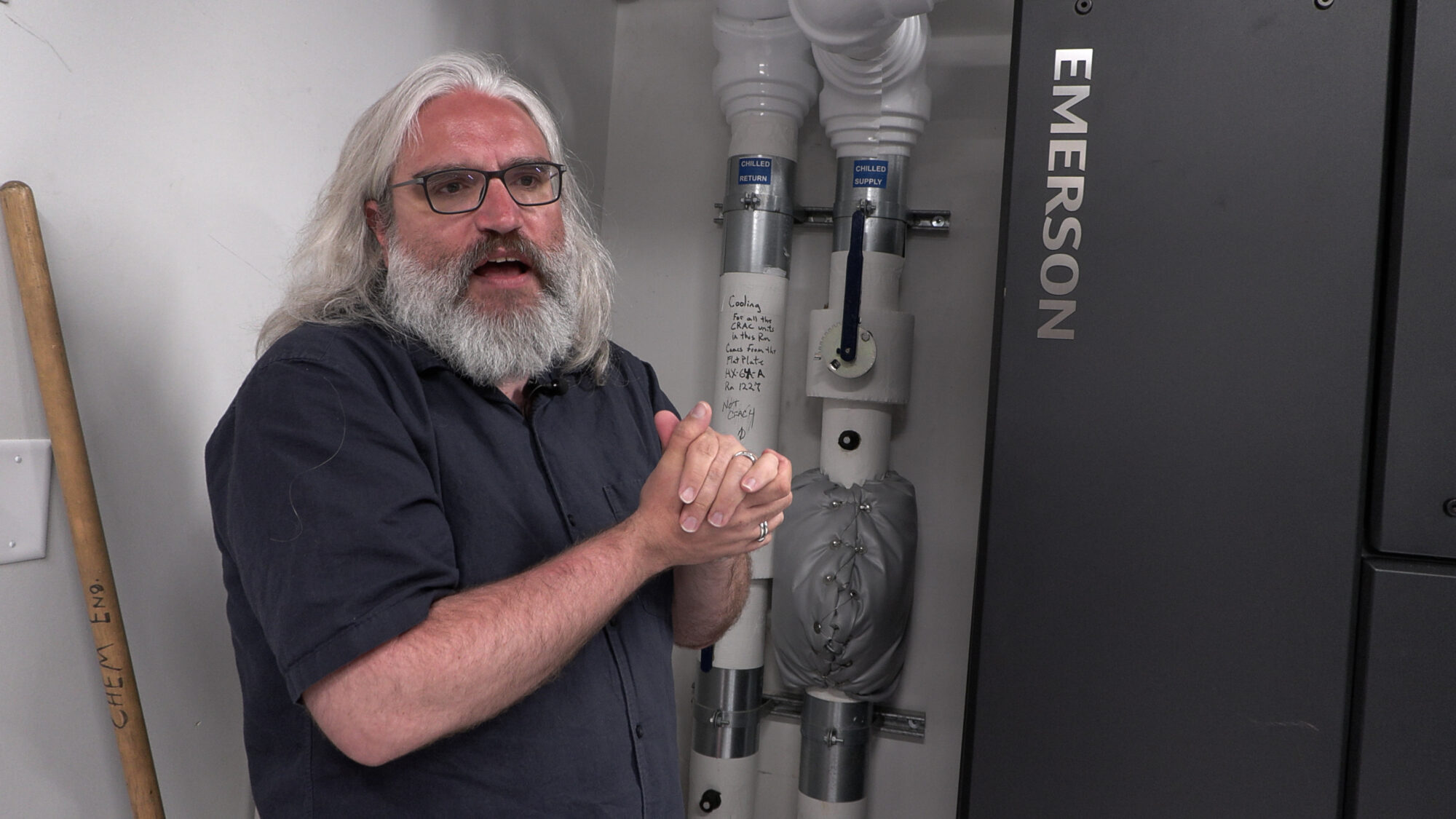 Dr. Robert Ricci describes how closed loop cooling works inside a small data center at the University of Utah. (Mike Anderson, KSL)